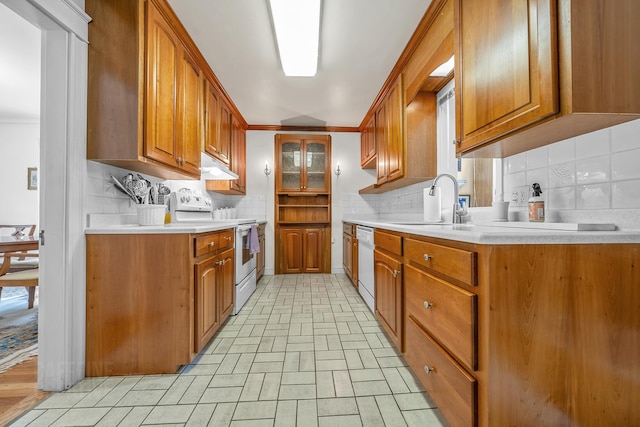42 Sylvan Rd, South Portland, ME 04106 - kitchen featuring white appliances, tasteful backsplash, light countertops, under cabinet range hood, and ornamental molding