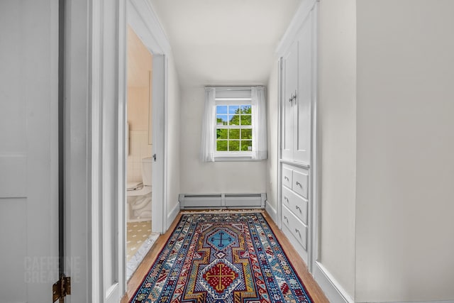 42 Sylvan Rd, South Portland, ME 04106 - corridor featuring a baseboard heating unit and light wood-style flooring