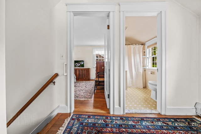 42 Sylvan Rd, South Portland, ME 04106 - corridor with wood finished floors, lofted ceiling, and an upstairs landing