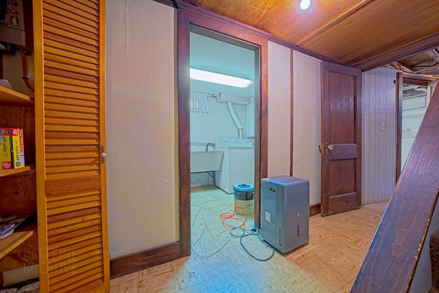 42 Sylvan Rd, South Portland, ME 04106 - hallway featuring washer / dryer, tile patterned floors, wooden ceiling, and water heater