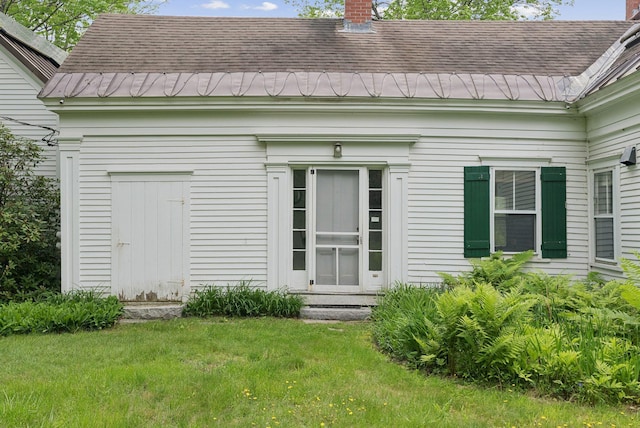 168 S Rd, Chebeague Island, ME 04017 - rear view of house featuring a chimney, a lawn, and a shingled roof
