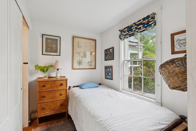 168 S Rd, Chebeague Island, ME 04017 - bedroom featuring dark wood-type flooring and baseboard heating