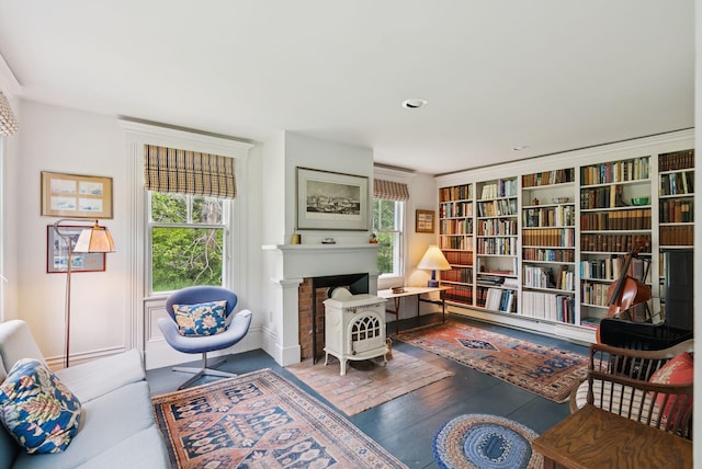 168 S Rd, Chebeague Island, ME 04017 - sitting room with healthy amount of natural light, wood-type flooring, and a fireplace