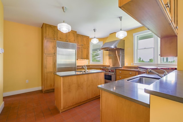60 Cobb Rd, Belfast, ME 04915 - kitchen with high end appliances, wall chimney range hood, a sink, and baseboards