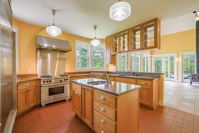 60 Cobb Rd, Belfast, ME 04915 - kitchen with high quality appliances, a sink, tile patterned floors, and wall chimney exhaust hood