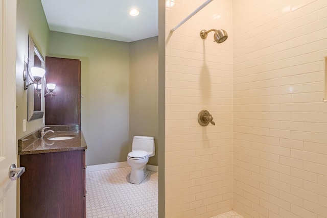 60 Cobb Rd, Belfast, ME 04915 - bathroom with vanity, a tile shower, toilet, tile patterned flooring, and baseboards