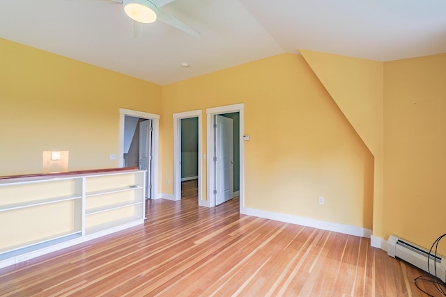 60 Cobb Rd, Belfast, ME 04915 - spare room featuring a baseboard radiator, light wood finished floors, a ceiling fan, baseboards, and vaulted ceiling