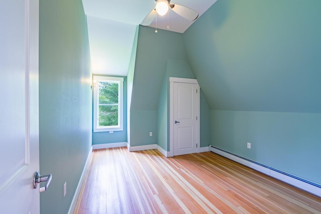 60 Cobb Rd, Belfast, ME 04915 - additional living space with a baseboard heating unit, wood finished floors, a ceiling fan, vaulted ceiling, and baseboards