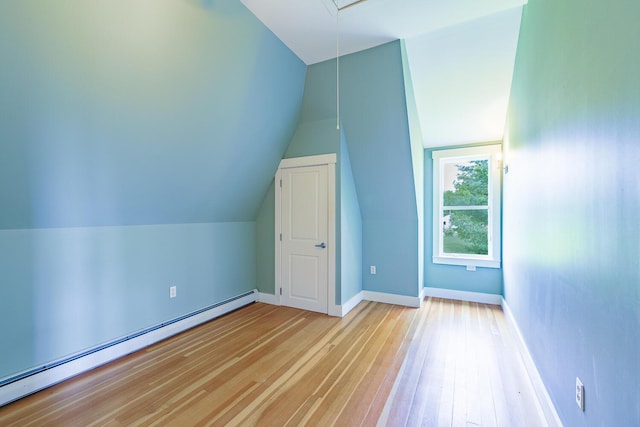 60 Cobb Rd, Belfast, ME 04915 - bonus room featuring a baseboard radiator, wood-type flooring, vaulted ceiling, attic access, and baseboards