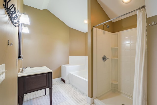 60 Cobb Rd, Belfast, ME 04915 - full bath with a garden tub, lofted ceiling, vanity, tiled shower, and baseboards