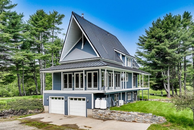 60 Cobb Rd, Belfast, ME 04915 - view of front of house with metal roof, a standing seam roof, and a front yard