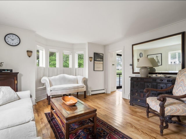 2593 Bristol Rd, Bristol, ME 04554 - living area featuring light wood-type flooring, plenty of natural light, crown molding, and baseboard heating
