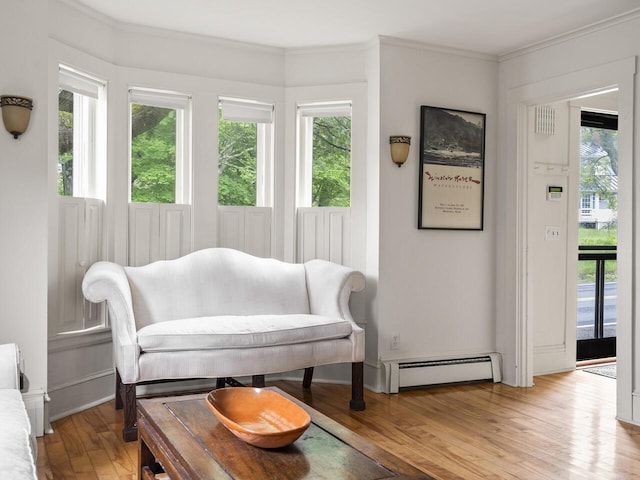 2593 Bristol Rd, Bristol, ME 04554 - sitting room featuring baseboard heating, light wood-type flooring, and crown molding