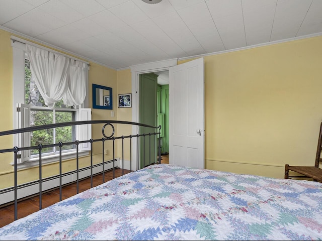 2593 Bristol Rd, Bristol, ME 04554 - bedroom with crown molding, a baseboard radiator, and wood finished floors
