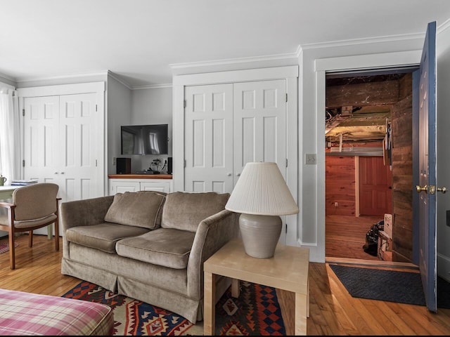 2593 Bristol Rd, Bristol, ME 04554 - living area with wood-type flooring and crown molding