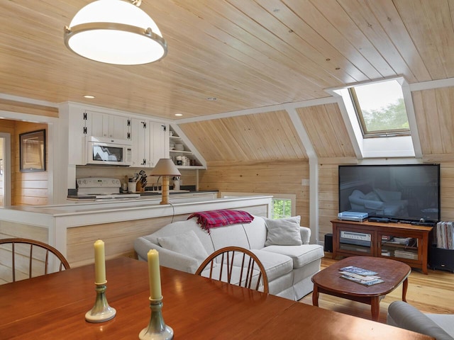 2593 Bristol Rd, Bristol, ME 04554 - dining area featuring wood walls, wooden ceiling, a skylight, lofted ceiling, and plenty of natural light
