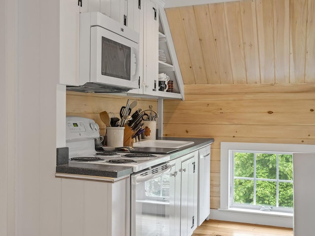 2593 Bristol Rd, Bristol, ME 04554 - kitchen featuring white appliances, dark countertops, and white cabinets