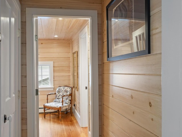 2593 Bristol Rd, Bristol, ME 04554 - corridor with wood walls and light wood finished floors