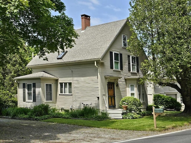2593 Bristol Rd, Bristol, ME 04554 - view of front of house with a chimney, roof with shingles, and a front lawn