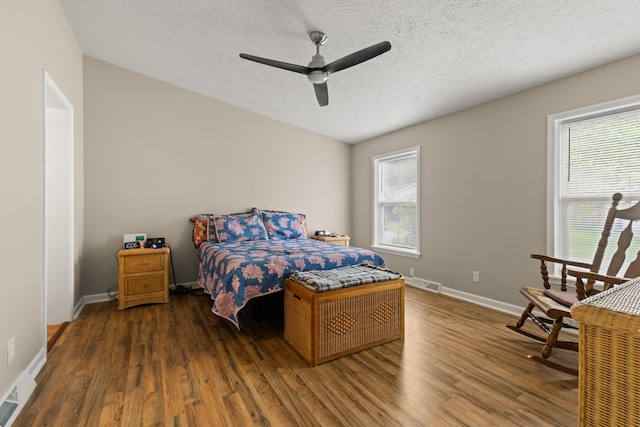 7 Bobcat Ln Unit 7, Berwick, ME 03901 - bedroom featuring multiple windows, wood finished floors, a textured ceiling, and baseboards