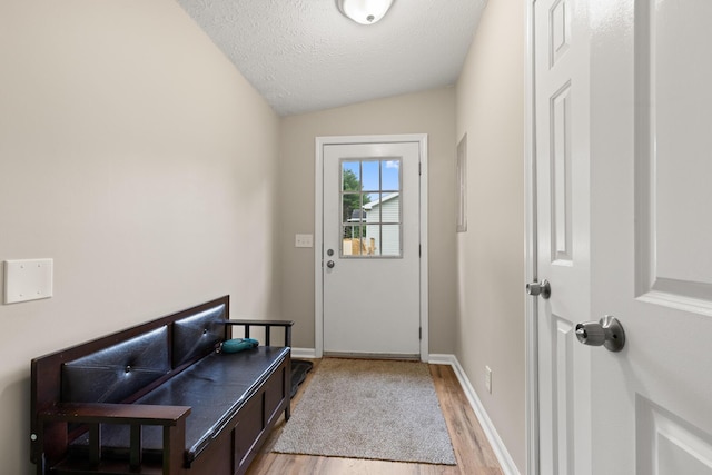 7 Bobcat Ln Unit 7, Berwick, ME 03901 - entryway featuring light wood-type flooring, vaulted ceiling, baseboards, and a textured ceiling