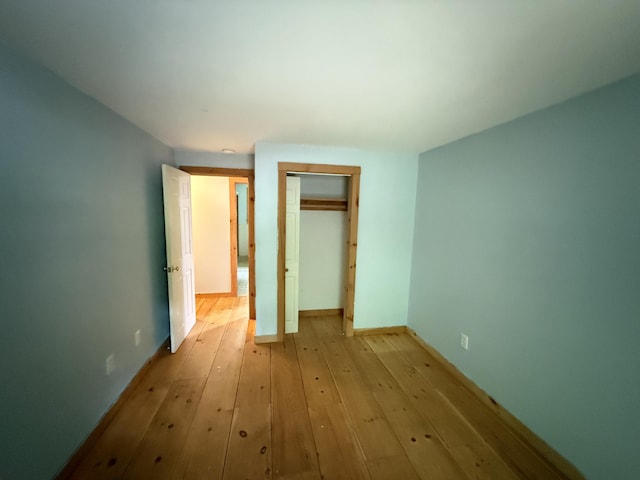 22 Dutton Hill Rd, Windham, ME 04062 - unfurnished bedroom with light wood-type flooring, a closet, and baseboards