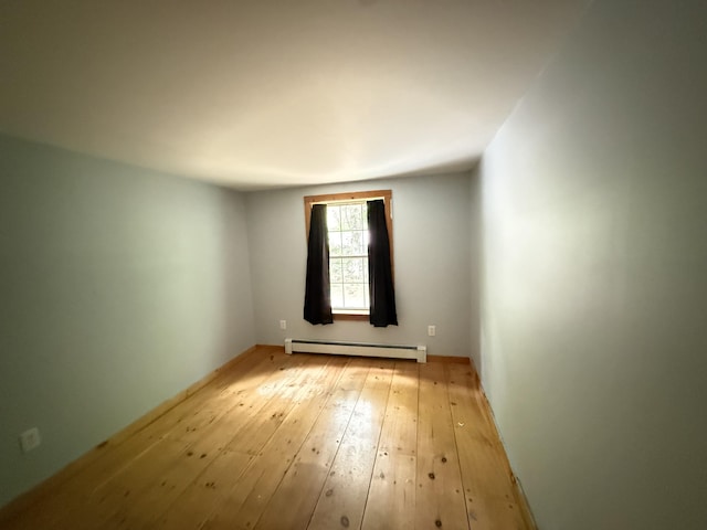 22 Dutton Hill Rd, Windham, ME 04062 - unfurnished room with a baseboard radiator and light wood finished floors