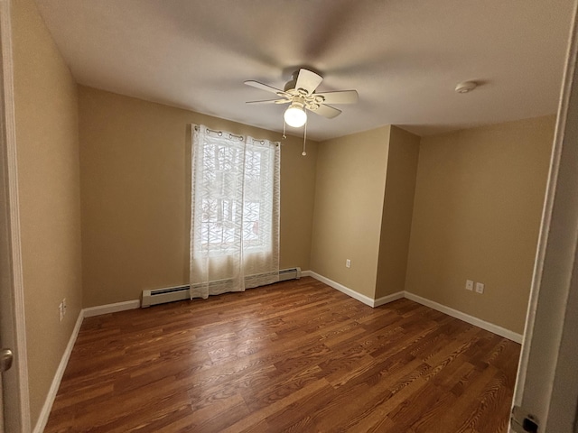 69 Frasier Ln, Acton, ME 04001 - spare room with ceiling fan, baseboard heating, wood finished floors, and a smoke detector