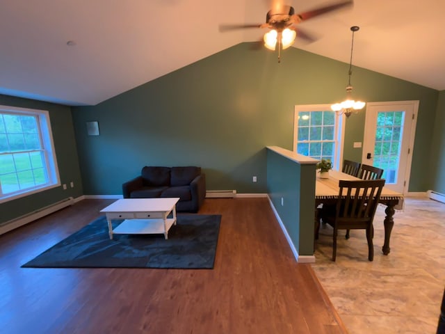 69 Frasier Ln, Acton, ME 04001 - living area featuring a ceiling fan, wood finished floors, lofted ceiling, a chandelier, and a baseboard heating unit