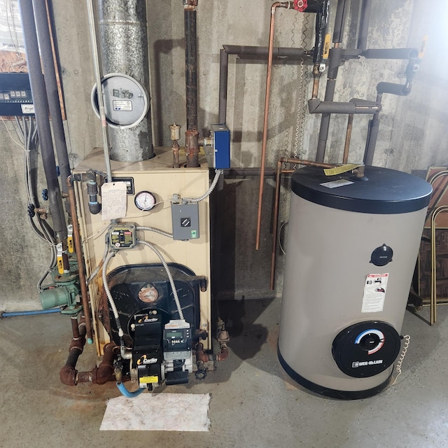 116 Main Rd, Passadumkeag, ME 04475 - utility room with electric water heater and a heating unit