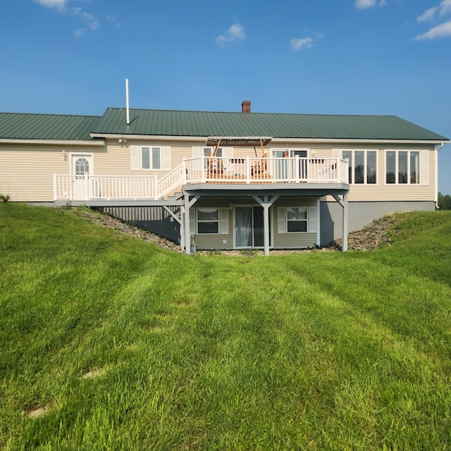 116 Main Rd, Passadumkeag, ME 04475 - back of property featuring a deck, a chimney, and a lawn