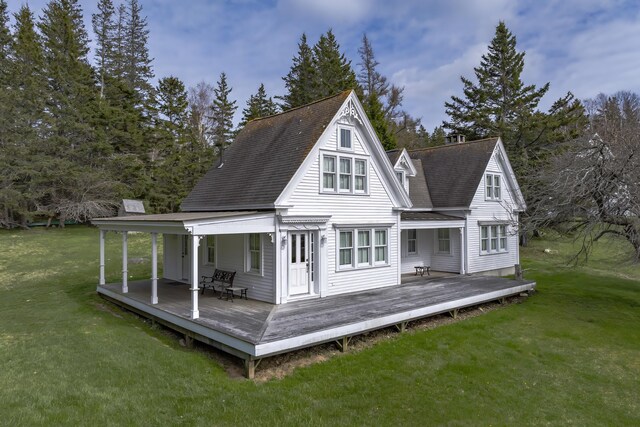 55 Ferry Rd, Swans Island, ME 04685 - back of property with a lawn, a wooden deck, and a shingled roof