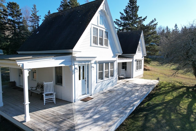 55 Ferry Rd, Swans Island, ME 04685 - rear view of property featuring a deck and a lawn