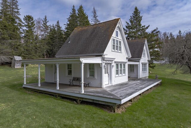 55 Ferry Rd, Swans Island, ME 04685 - rear view of house with a shingled roof and a yard