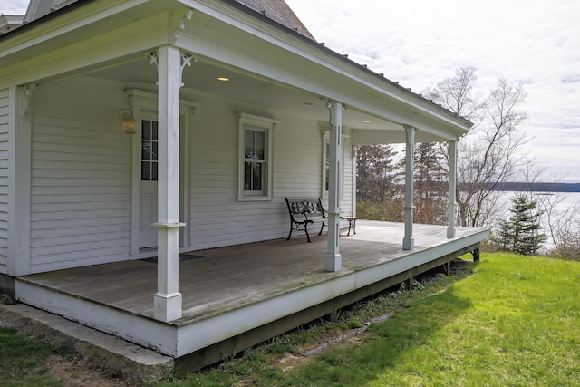 55 Ferry Rd, Swans Island, ME 04685 - wooden terrace with a water view and a lawn