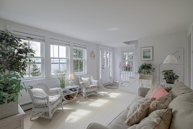 55 Ferry Rd, Swans Island, ME 04685 - living area with healthy amount of natural light, stairway, and a baseboard radiator