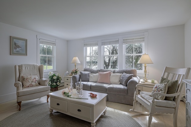 55 Ferry Rd, Swans Island, ME 04685 - living room featuring a baseboard heating unit