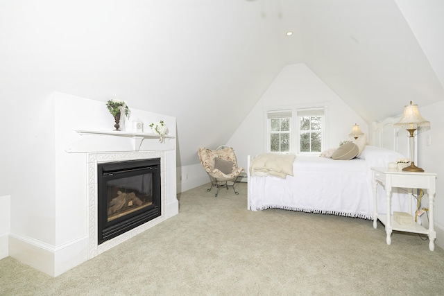 55 Ferry Rd, Swans Island, ME 04685 - carpeted bedroom featuring a fireplace, lofted ceiling, and baseboards