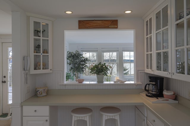 55 Ferry Rd, Swans Island, ME 04685 - kitchen featuring light countertops, glass insert cabinets, and recessed lighting