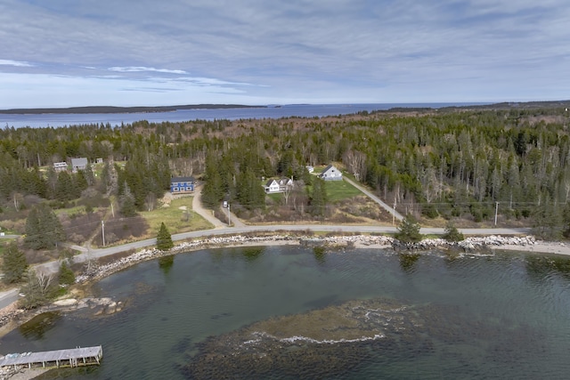 55 Ferry Rd, Swans Island, ME 04685 - aerial overview of property's location featuring a heavily wooded area and a large body of water