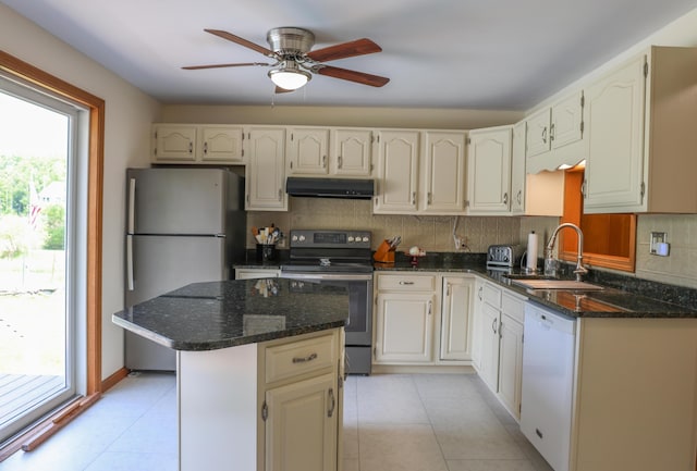 178 Clinton Ave, Winslow, ME 04901 - kitchen with stainless steel appliances, a sink, under cabinet range hood, ceiling fan, and light tile patterned floors