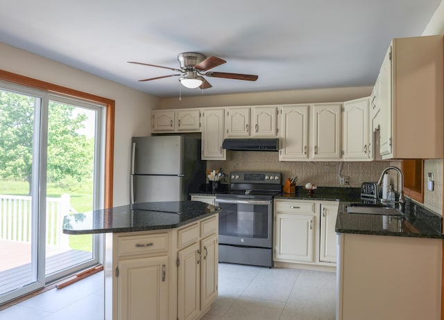 178 Clinton Ave, Winslow, ME 04901 - kitchen with appliances with stainless steel finishes, a sink, under cabinet range hood, ceiling fan, and decorative backsplash