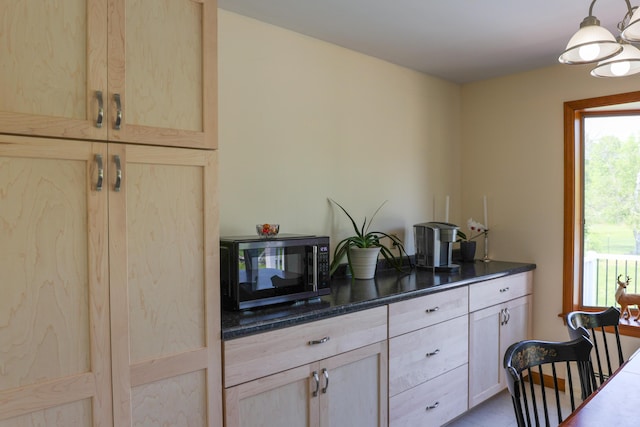 178 Clinton Ave, Winslow, ME 04901 - kitchen with light brown cabinets and hanging light fixtures