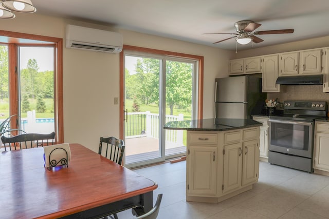 178 Clinton Ave, Winslow, ME 04901 - kitchen with appliances with stainless steel finishes, a wall unit AC, under cabinet range hood, a ceiling fan, and backsplash