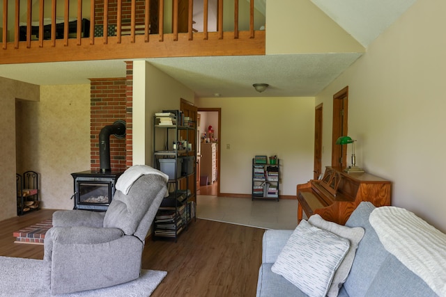 178 Clinton Ave, Winslow, ME 04901 - living area with a wood stove and wood finished floors