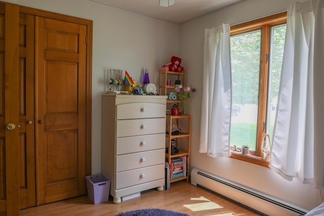 178 Clinton Ave, Winslow, ME 04901 - bedroom featuring a baseboard radiator and light wood finished floors