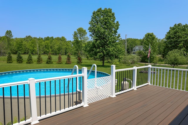 178 Clinton Ave, Winslow, ME 04901 - outdoor pool featuring a yard, a wooden deck, and view of scattered trees