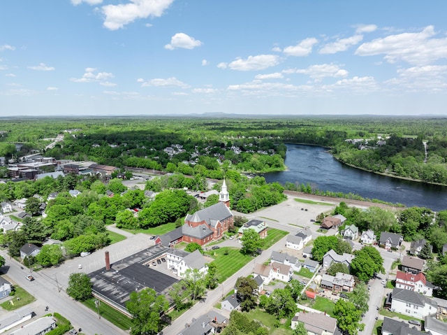 32 Carroll St, Old Town, ME 04468 - aerial view of residential area featuring a nearby body of water and a heavily wooded area