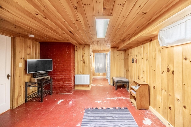 32 Carroll St, Old Town, ME 04468 - sitting room featuring radiator heating unit, wood walls, and wood ceiling