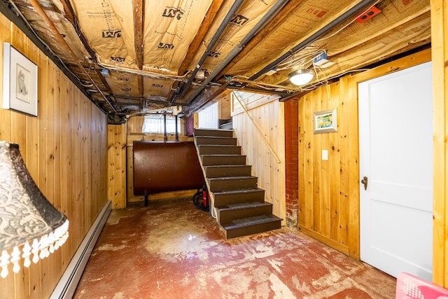 32 Carroll St, Old Town, ME 04468 - basement with oil tank, wood walls, stairway, and baseboard heating